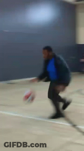 Blurry Man Kicking Soccer Ball GIF