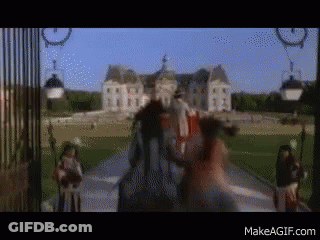 A Blurry Picture Of A Man Riding A Horse In Front Of A Castle With The Website Makeagif.com Visible GIF