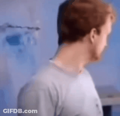 A Blurry Picture Of A Man 'S Face And Neck GIF