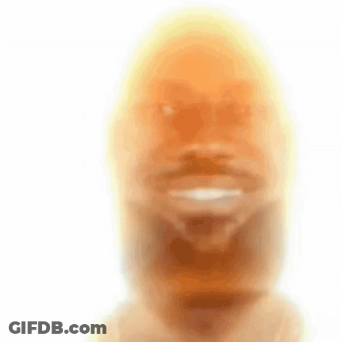 A Blurry Picture Of A Man 'S Face With A Beard . GIF