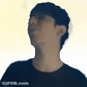 A Blurry Picture Of A Man 'S Face With A Yellow Background GIF