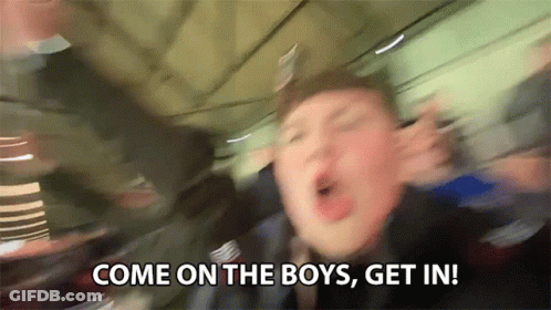 A Blurry Picture Of A Man Saying Come On The Boys Get In ! GIF