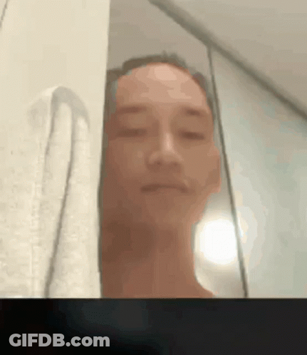 A Blurry Picture Of A Man Taking A Selfie GIF