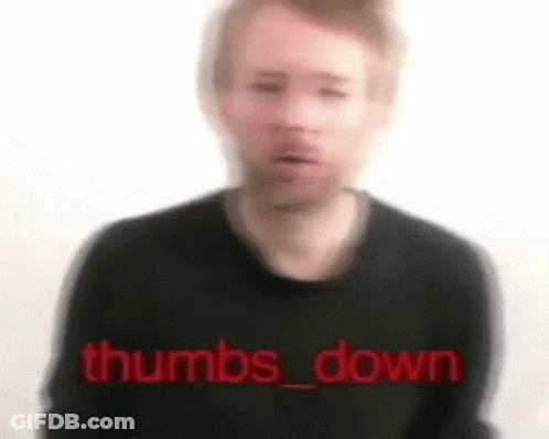 A Blurry Picture Of A Man Wearing A Black Sweater With The Words `` Thumbs Down '' Written In Red . GIF