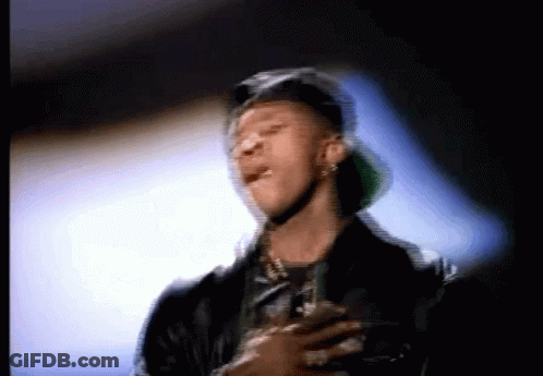 A Blurry Picture Of A Man Wearing A Hat And A Jacket GIF