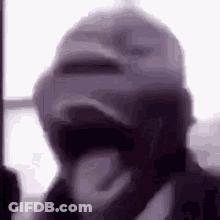 Blurry Man Wearing Hat And Mask GIF