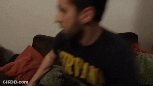 A Blurry Picture Of A Man Wearing A Shirt That Says ' Army ' On It GIF