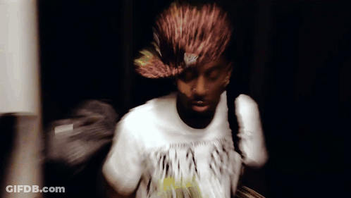 A Blurry Picture Of A Man Wearing A T-Shirt That Says ' A ' On It GIF