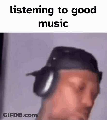 A Blurry Picture Of A Man Wearing Headphones And A Hat . GIF