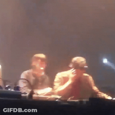 A Blurry Picture Of A Man Wearing Headphones And Sunglasses GIF