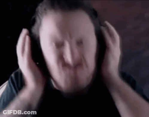 A Blurry Picture Of A Man Wearing Headphones . GIF
