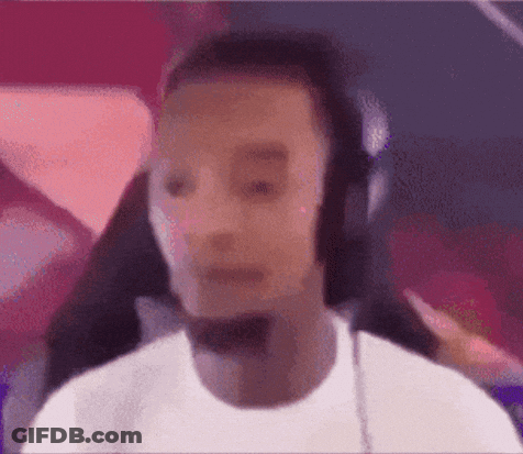 A Blurry Picture Of A Man Wearing Headphones . GIF