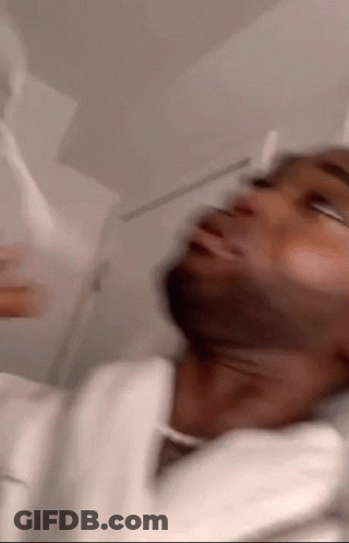 A Blurry Picture Of A Man With A White Robe On GIF