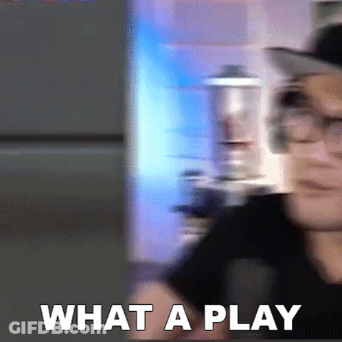 A Blurry Picture Of A Man With Glasses And The Words What A Play In White Letters GIF