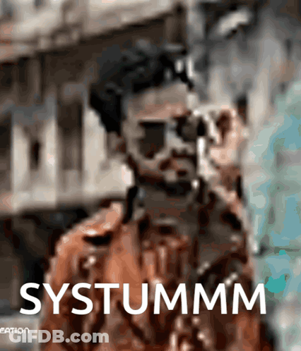 A Blurry Picture Of A Man With The Word Systummm On The Bottom Right GIF