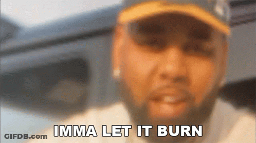 A Blurry Picture Of A Man With The Words Imma Let It Burn Above Him GIF