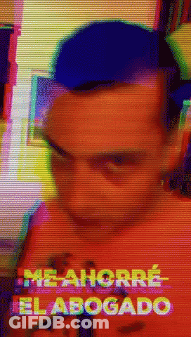A Blurry Picture Of A Man With The Words Me Ahorro El Abogado In The Corner GIF