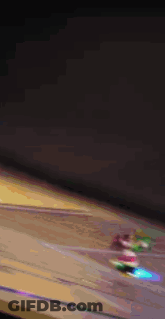 A Blurry Picture Of A Monkey On A Stage With A Castle In The Background GIF