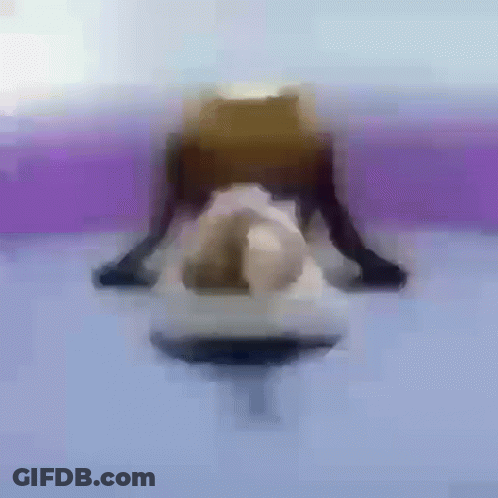 A Blurry Picture Of A Person Doing A Yoga Pose On A Purple Surface . GIF
