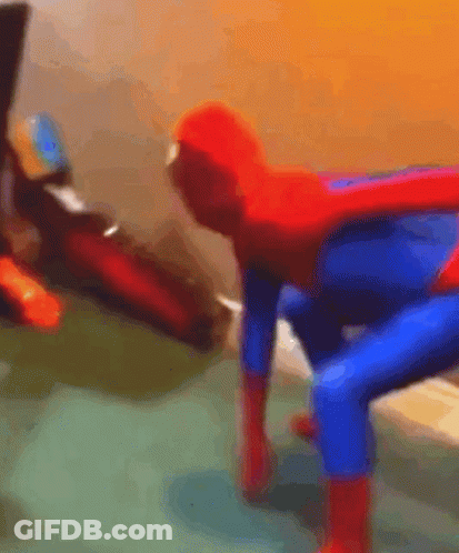 A Blurry Picture Of A Person Dressed As A Spiderman GIF