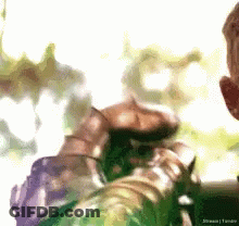 A Blurry Picture Of A Person Holding A Green Object With The Word Stream Written On The Bottom GIF