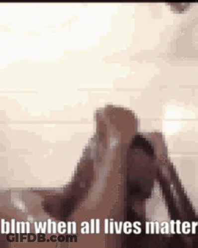 A Blurry Picture Of A Person Holding Their Head And The Words Blm When All Lives Matter . GIF