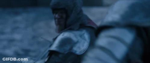 A Blurry Picture Of A Person In A Hooded Jacket In The Snow GIF