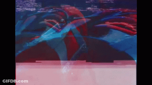 A Blurry Picture Of A Person In A Red And Blue Suit GIF