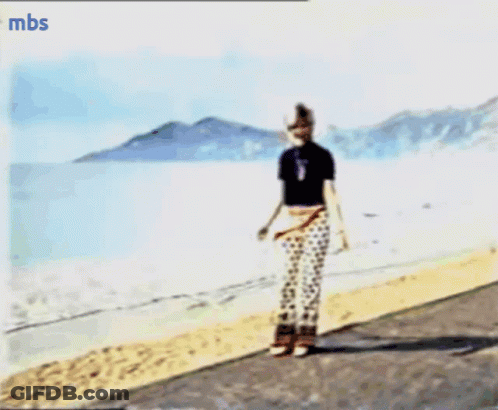 A Blurry Picture Of A Person On A Beach With Mbs Written On The Bottom Right GIF