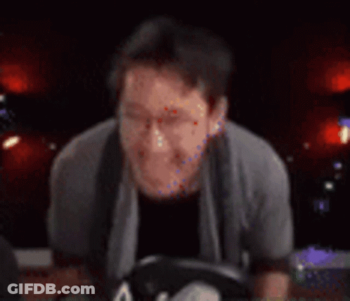 Blurry Person Playing Guitar In Dark Room GIF