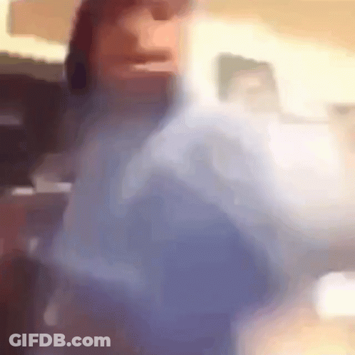 A Blurry Picture Of A Person 'S Face And Shoulder GIF