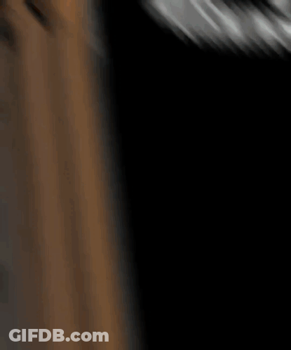A Blurry Picture Of A Person 'S Face In A Dark Room .. GIF