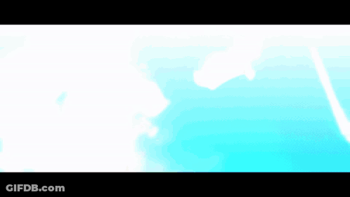 A Blurry Picture Of A Person 'S Face With A Blue Background . GIF