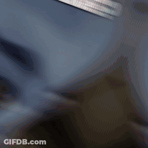 A Blurry Picture Of A Person 'S Face With A Crown On It GIF