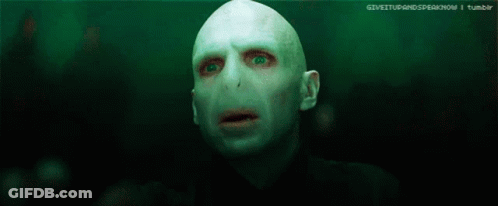 A Blurry Picture Of A Person 'S Face With A Light Behind Them GIF