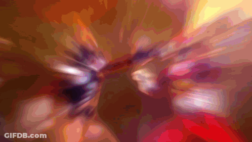 A Blurry Picture Of A Person 'S Face With A Purple And Orange Background GIF