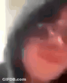 A Blurry Picture Of A Person 'S Face With A Red Lip GIF