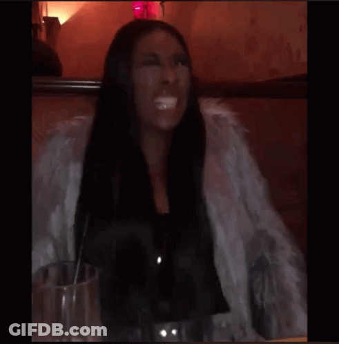 A Blurry Picture Of A Person 'S Face With A Red Spot GIF