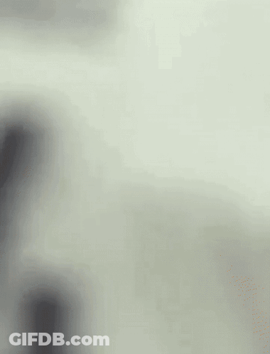 A Blurry Picture Of A Person 'S Face With A White Background GIF