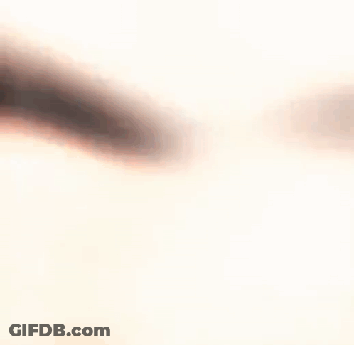 A Blurry Picture Of A Person 'S Face With A White Background . GIF