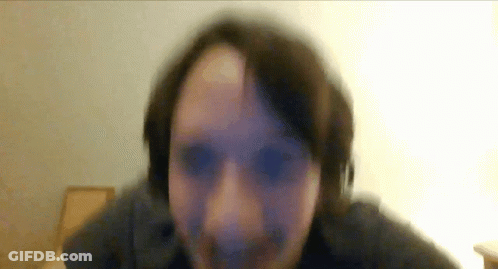 A Blurry Picture Of A Person 'S Face With A White Background GIF