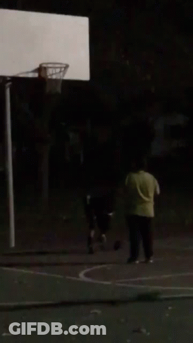 A Blurry Picture Of A Person Sitting In A Dark Room . GIF