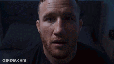 A Blurry Picture Of A Person Standing In A Dark Room In Front Of A Window . GIF