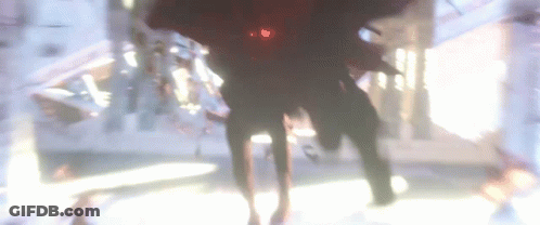 A Blurry Picture Of A Person Standing In A Room GIF