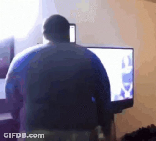 A Blurry Picture Of A Person Standing In Front Of A Tv GIF