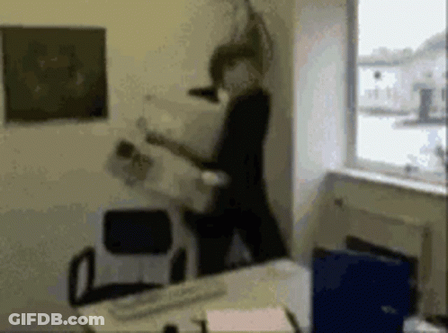 A Blurry Picture Of A Person Standing In Front Of A Window GIF