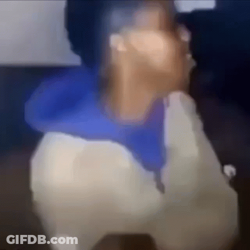 A Blurry Picture Of A Person Talking On A Phone . GIF