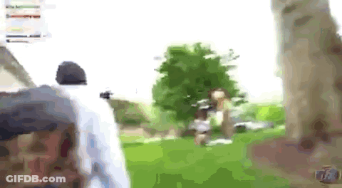 A Blurry Picture Of A Person Walking In A Park . GIF