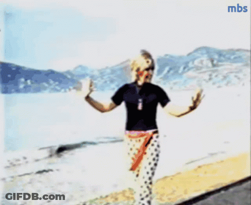 A Blurry Picture Of A Person Walking On A Beach With Mbs Written In The Corner GIF