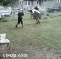 A Blurry Picture Of A Person Walking On A Grassy Field GIF